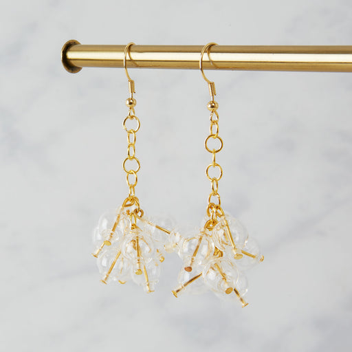 Brass earrings with nine glass beads in a bubble 